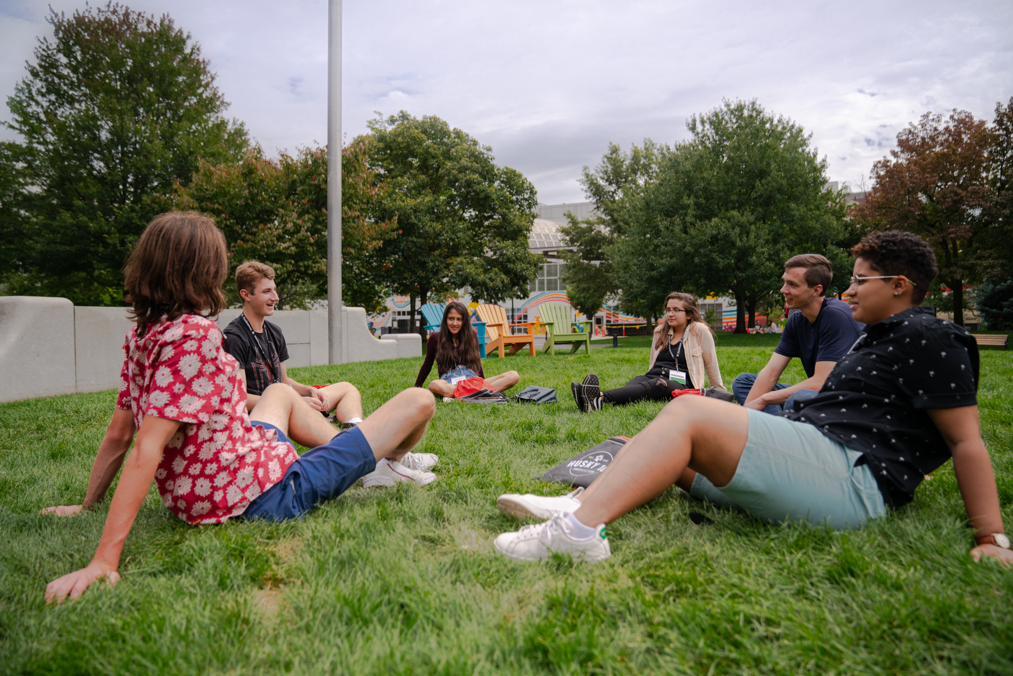 students sitting on ground in circle