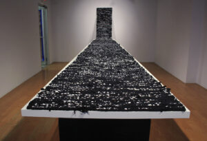 Fafnir Adamites, A Record of Obscured Meaning, used tshirts and cotton thread, 2018, 25 ft x 2.5ft