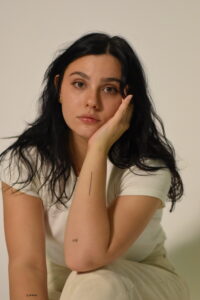 Photo shows Azra Schorr, posing for a photo in the studio. 