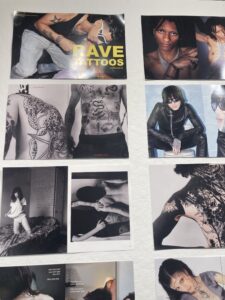 The photo shows spreads of Azra Schorr's magazine installed in Gallery360. The photos show youth with tattoos and fashionable, trendy outfits.